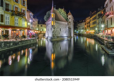ANNECY, FRANCE - SEPTEMBER 14, 2014: Medieval castle on the canal at night in the French city of Annecy.