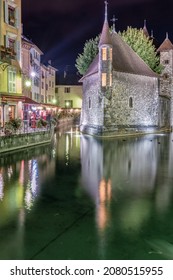 ANNECY, FRANCE - SEPTEMBER 14, 2014: Medieval castle on the canal at night in the French city of Annecy.