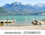 Annecy lake in France with turquoise water, mountains and swans