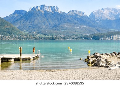 Annecy lake in France with turquoise water, mountains and swans - Powered by Shutterstock