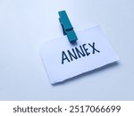 Annex writting on table background.