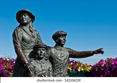 The Annie Moore Memorial, statue of Annie Moore and her two Brothers in Cobh, Ireland (Annie was the first immigrant to the United States to pass through the Ellis Island facility in New York Harbor)