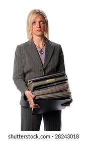 Annoyed businesswoman holding large stack of files
