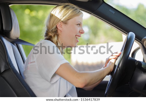 annoyed female driver inside a\
car