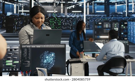 Annoyed high tech server room system admin having trouble doing visual programming with irked woman in server room having buggy issues.