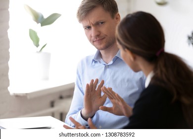 Annoyed Man Discussing Working Moments And Disagreed With Colleague. Hr Manager Showing With Hands Gesture Protest And Rejection Want To Finish Unsuccessful Job Interview. Bad First Impression Concept