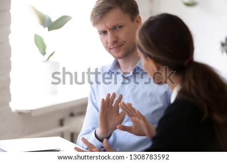 Annoyed man discussing working moments and disagreed with colleague. Hr manager showing with hands gesture protest and rejection want to finish unsuccessful job interview. Bad first impression concept