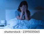 Annoyed, stressed, anxiety asian young woman suffering from insomnia, frustrated awake on bed at night, headache or migraine, health care problem, disturbed trouble of loud noise, unable sleepless.