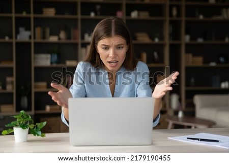 Annoyed stressed businesswoman having problem with laptop, broken or discharged device. Office employee looks at screen, read awful news feels shocked, unexpected app crash, unsaved data, spam concept