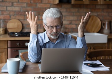 Annoyed worried aged man pensioner sit by laptop unable to make utility bill loan payment online has question how to use app need help. Stressed old grandpa confused with unexpected debt on pc screen