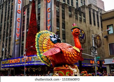 The annual Macy's Thanksgiving Day parade along Avenue of Americas with many balloons floating in the air. Manhattan, New York, USA - November 27, 2014.