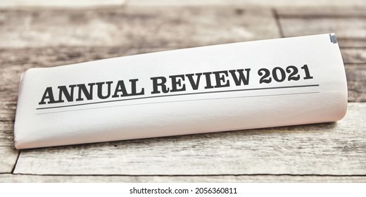 Annual Review 2021 As Front Page On Folded Newspaper