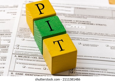 Annual Tax Settlement In Poland, Form For Private Persons, Wooden Blocks With The Word PIT 