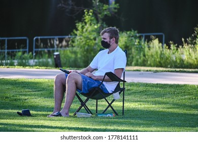 Anoka, MN/USA - July 17, 2020. A Man Wearing A Mask Listening To Music At An Outdoor Free Concert. 