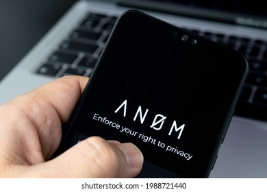 ANOM App Logo Seen On The Smartphone And Laptop On Blurred Background. Encrypted Messaging App Used In Global Crime Networks. Concept. Stafford, United Kingdom, July 9, 2021