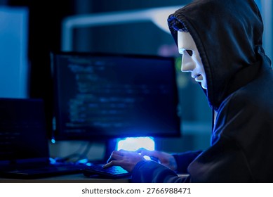 Anonymous black hat hacker executing advanced persistent threat via malware injection. Cybercriminal in mask conducting ransomware attack on digital infrastructure.