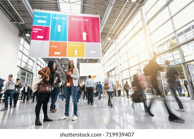 Anonymous Blurred Business People At A Trade Fair 