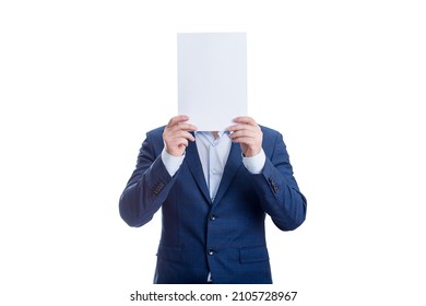 Anonymous Businessman Covering Face With A Blank Paper Sheet, Like A Mask To Hide Emotions. Incognito Person Hidden, Isolated On White Background. Introvert People Concept