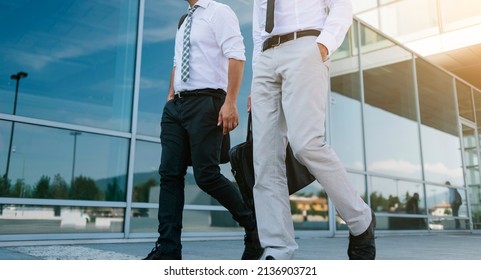 Anonymous Businessmen Walking Together Outside The Company