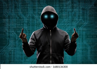 Anonymous computer hacker over abstract digital background. Obscured dark face in mask and hood. Data thief, internet attack, darknet fraud, dangerous viruses and cyber security . - Shutterstock ID 1680136300