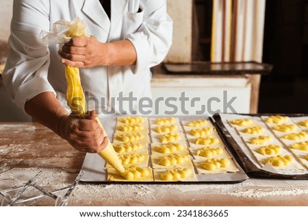 Similar – Image, Stock Photo Concentrated chef adding cream inside ceramic plate
