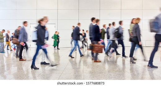 Anonymous Crowd People Is Walking In Trade Fair Or Airport In One Direction
