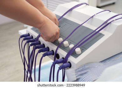 Anonymous Doctor Preparing Machine During Anti Cellulite Massage