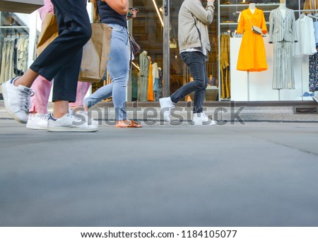 Similar – Image, Stock Photo Young woman walking past yellow building. Motion blur image. Person moving in the city.
