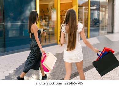 Anonymous Girlfriends Walking Past Shop