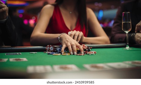 Anonymous Glamorous Woman in a Evening Dress Collecting her Prize of Poker Chips in a Luxury Casino. Lucky Female Winner Hitting the Jackpot, Happy and Rich.