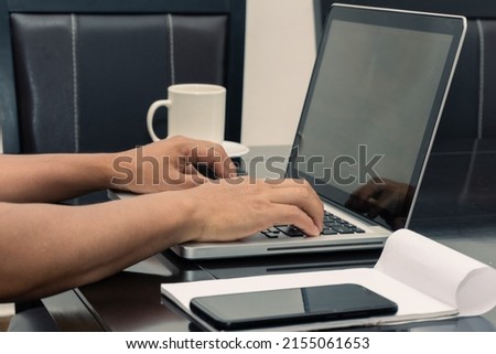 Anonymous Hands Of A Man Using His Laptop Computer