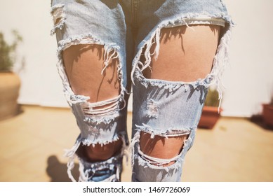 Anonymous image of woman with torn jeans on a summer day sexy