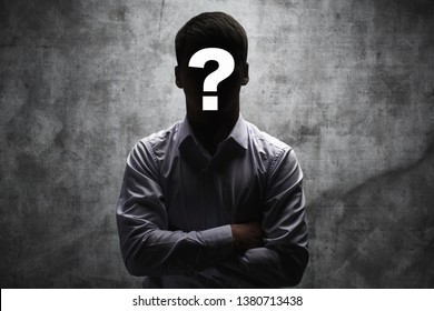 Anonymous man in a business shirt with question mark on his face on dark background