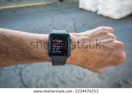 Anonymous Man Using A Digital Smartwatch. Close-up Of The Hand Of A Man With A Smart Watch After Finishing A Hiking Route Showing, The Elapsed Time, The Kilometers, Pulsations, Calories.