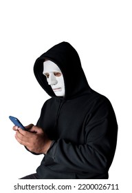 Anonymous Masked Hacker Is Using Smartphones To Penetrate Financial Data With Clipping Path, Hacking And Malware Concept.