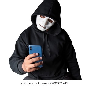 Anonymous Masked Hacker Is Using Smartphones To Penetrate Financial Data With Clipping Path, Hacking And Malware Concept.