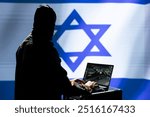 Anonymous Mossad military expert using laptop, operating anti ballistic system designed to counter missiles threatening country. Israeli intelligence operative in command room defends against rockets