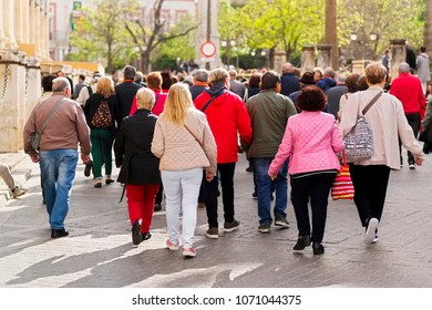 anonymous people walking on city street