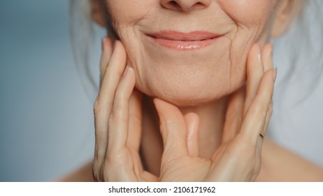 Anonymous Senior Woman Touching Her Neck, Chest, With Sensual Movement Of Hands, Enjoying Soft Skin. Elderly Female Natural Beauty. Dignity And Grace In Old Age. Concept For Skin Care, Healthy Living