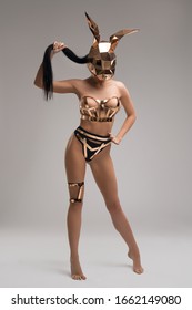 Anonymous sexy lady in metal bunny mask