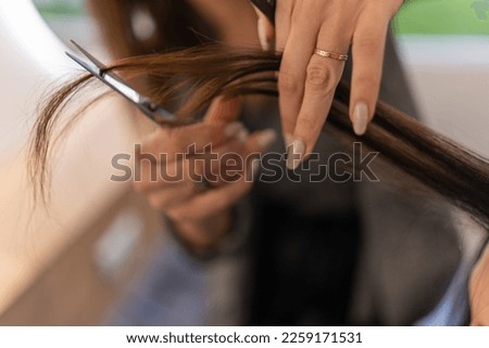 Similar – Image, Stock Photo Cropped unrecognizable female hairstylist using electric trimmer on male client’s hair at salon