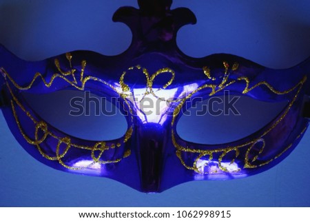 Anonymous violet carnaval mack isolated on blue background