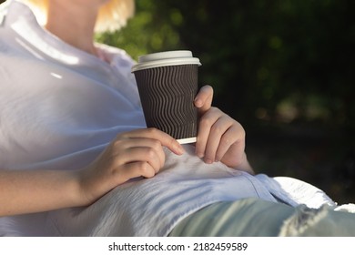 Anonymous Woman Holding Craft Paper Cup With Coffee Outside.