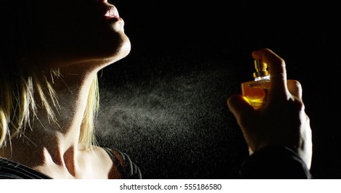 Anonymous Woman Spraying Fragrance In Extreme Slow Motion, With Scent Particles To Wet Skin After Showering.