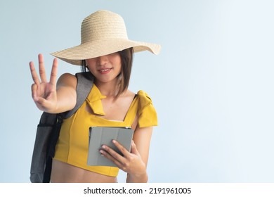 Anonymous Woman Traveler Holding Computer Tablet, Pointing Up Three Fingers, Number 3, Third Point Or Three Points Hand Gesture