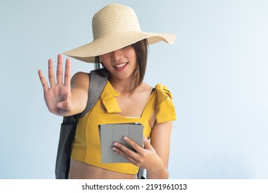 Anonymous Woman Traveler Holding Computer Tablet, Pointing Up Four Fingers, Number 4, Forth Point Or Four Points Hand Gesture