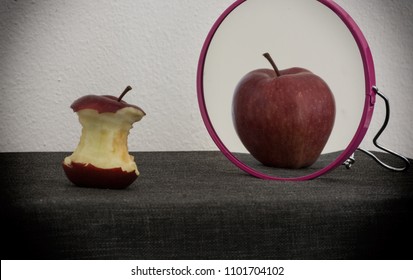 Anorexia Nervosa Explained By An Apple Looking Itself Into A Mirror With Distorted Image