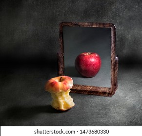Anorexic Apple Contemplating Its Reflection In A Mirror