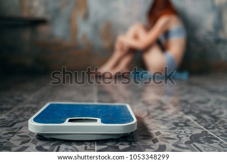 Anorexic woman sitting on the floor, weight loss Imagine de stoc © 