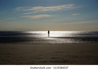 Another Place, A Piece Of Modern Sculpture By Sir Antony Gormley Located At Crosby Beach
Liverpool City Region, England, United Kingdom          